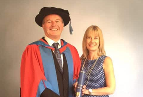 Adams receiving award