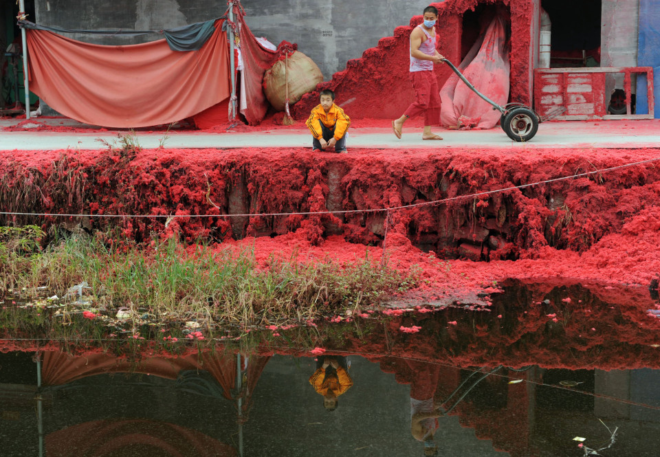 River in China impacted by red dye.