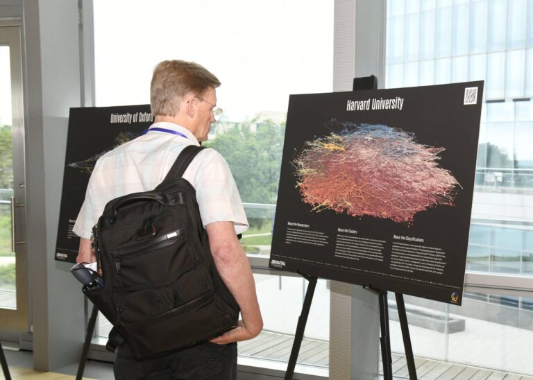 Visitor to the What does a university look like? exhibit