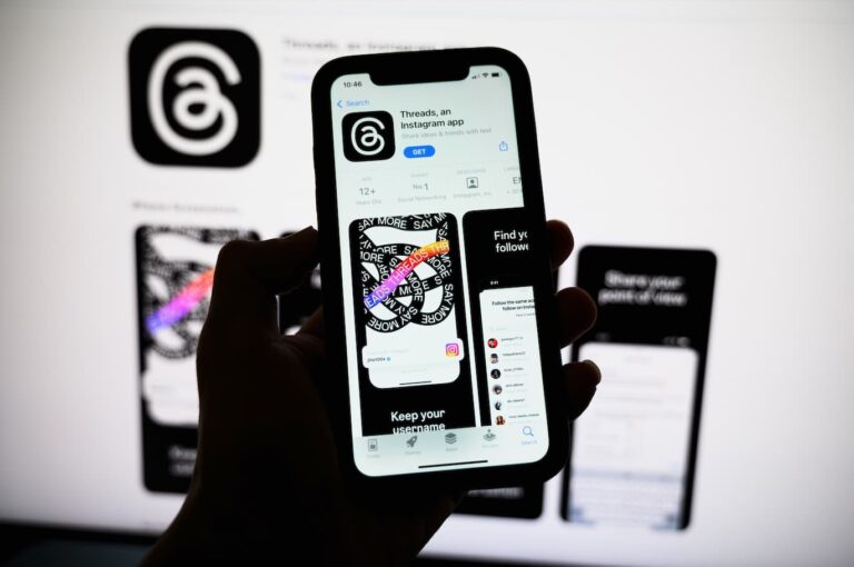Photo of phone showing interface of Meta's Threads app