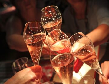 Prosecco glasses raised