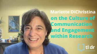 Mariette DiChristina sits at her desk in her office facing the camera