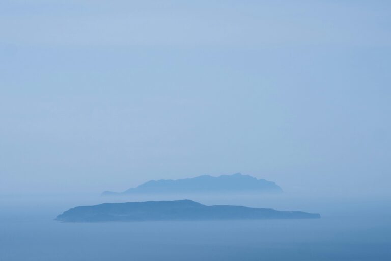 mountaintops poking up through clouds