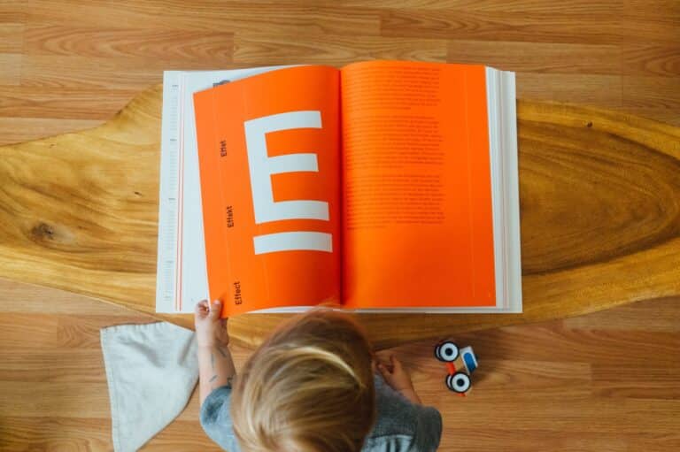 child looking at graphics book